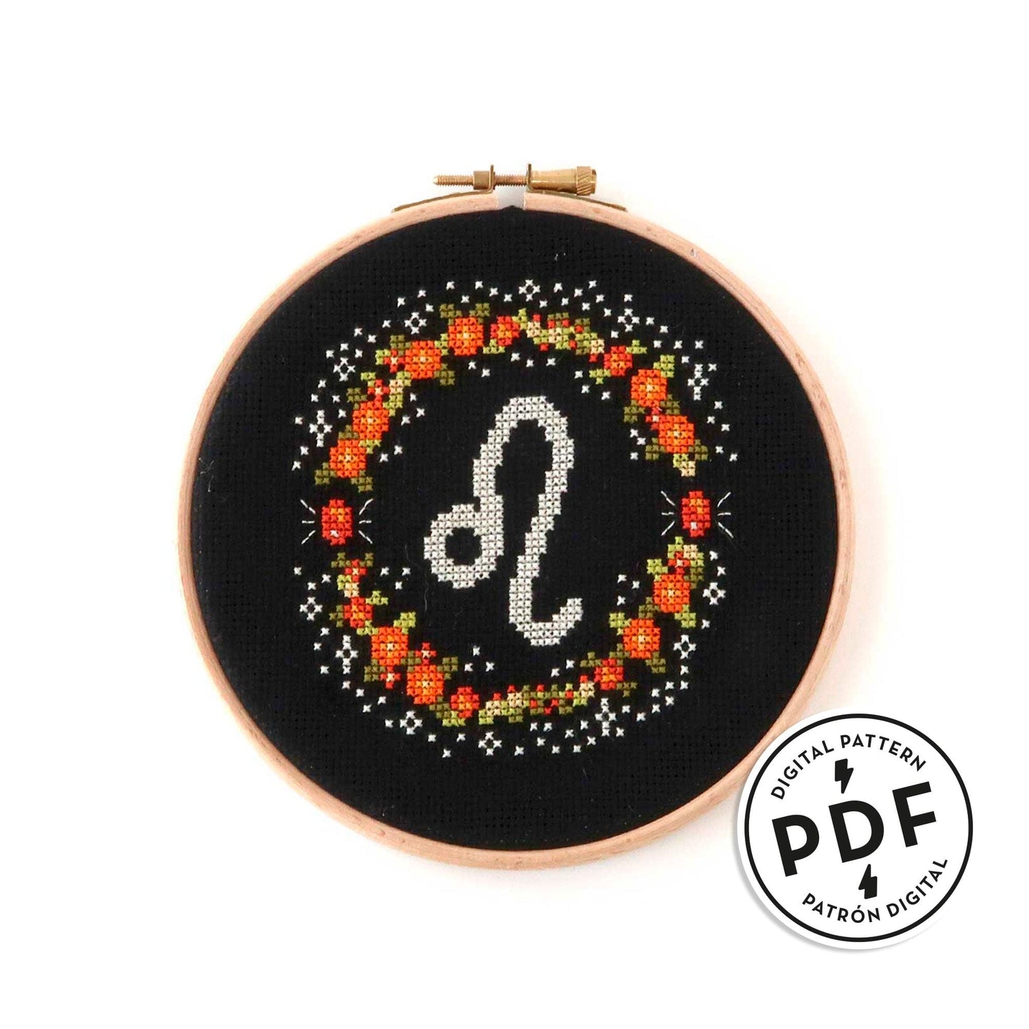 Patrón de punto de cruz en PDF con el signo de Leo rodeado de flores en tonos de naranja. Signo del zodíaco de punto de cruz moderno y redondo para enmarcar en aro de bordar.
