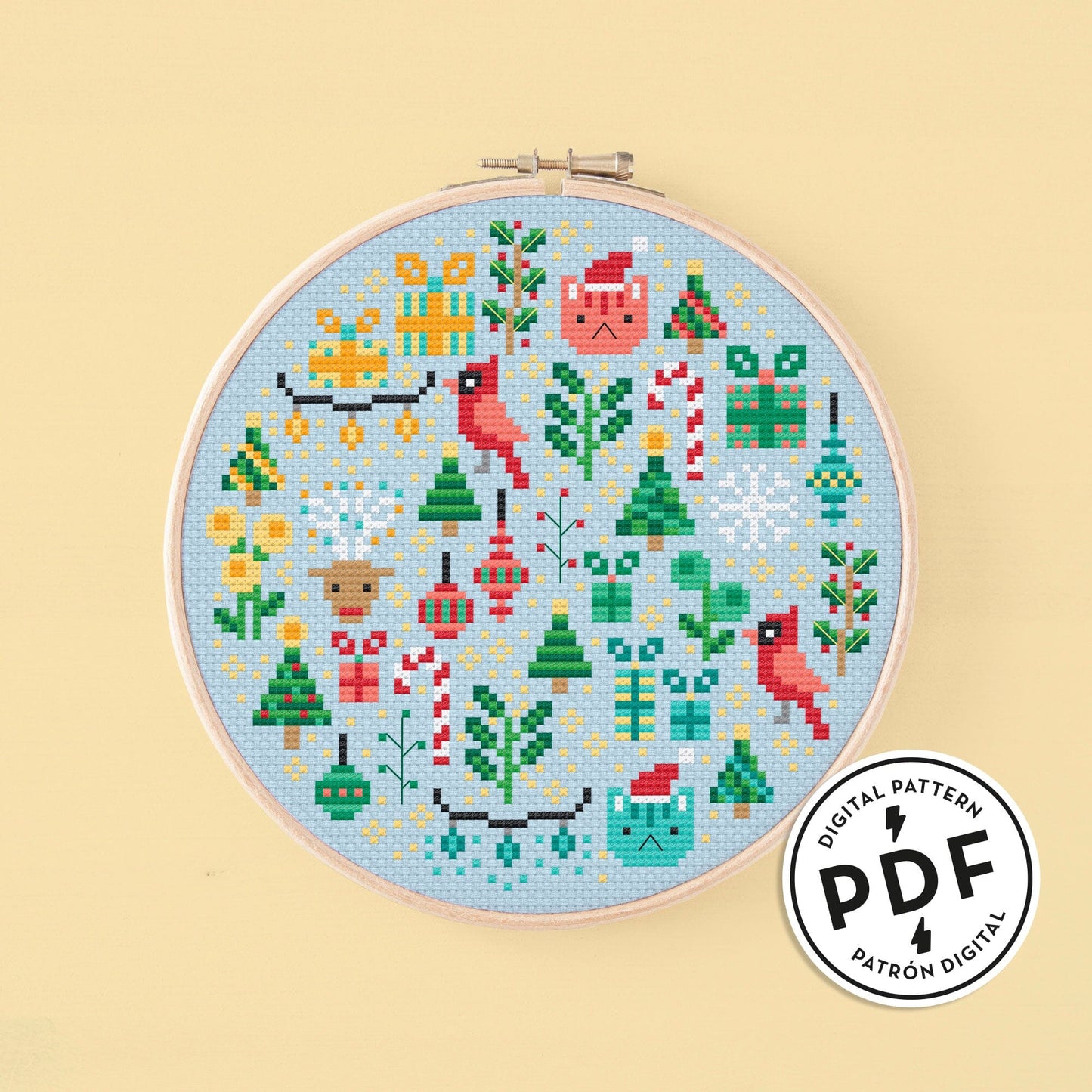 Esquema de punto de cruz en pdf "Mini Christmas Garden". Bordado redondo con elementos navideños como renos, luces de colores, bolas para el árbol, árboles de navidad, estrellas de nieve, bastones de caramelo, etc. Punto de cruz de navidad moderno y original.